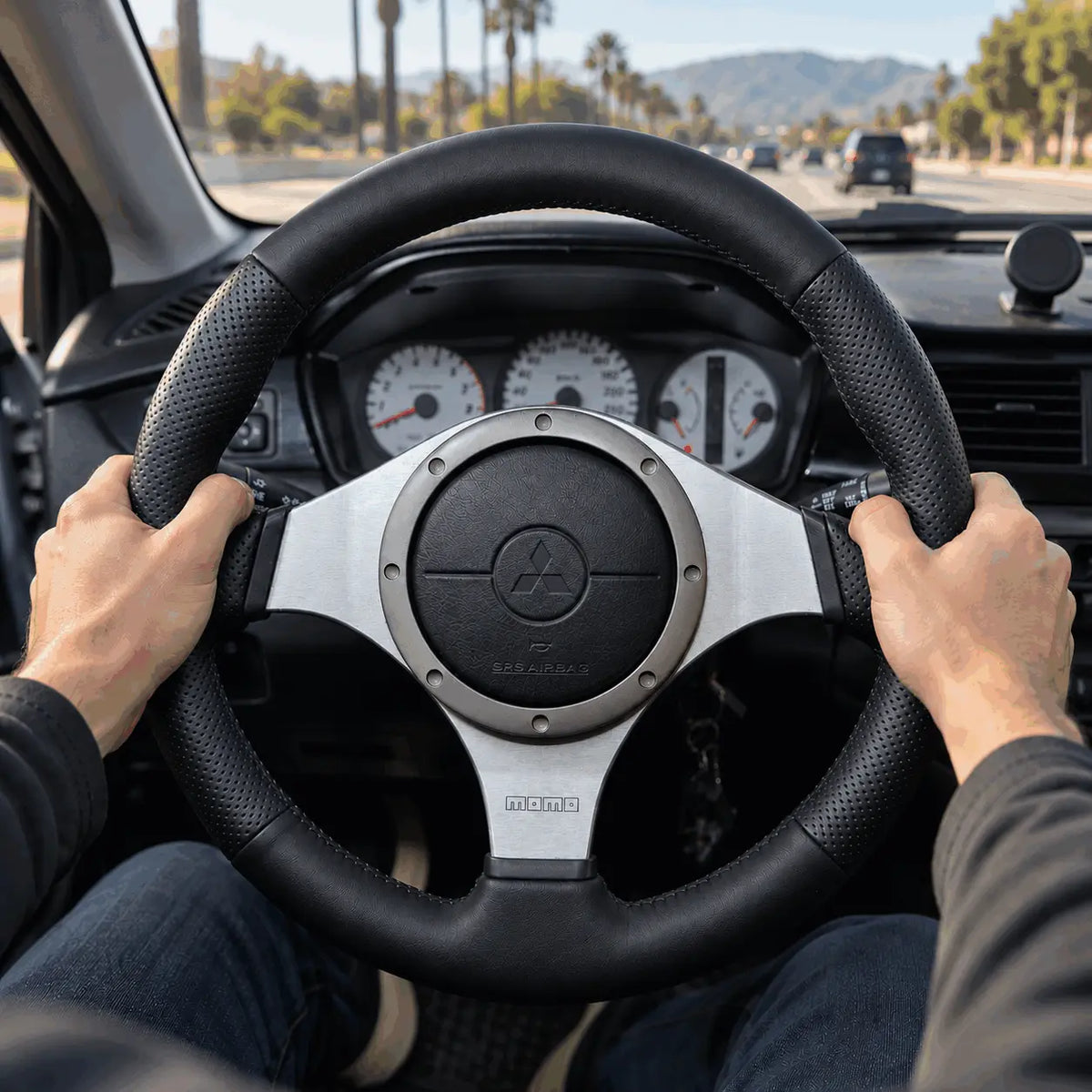 Hand gripping a premium stitched steering wheel wrap